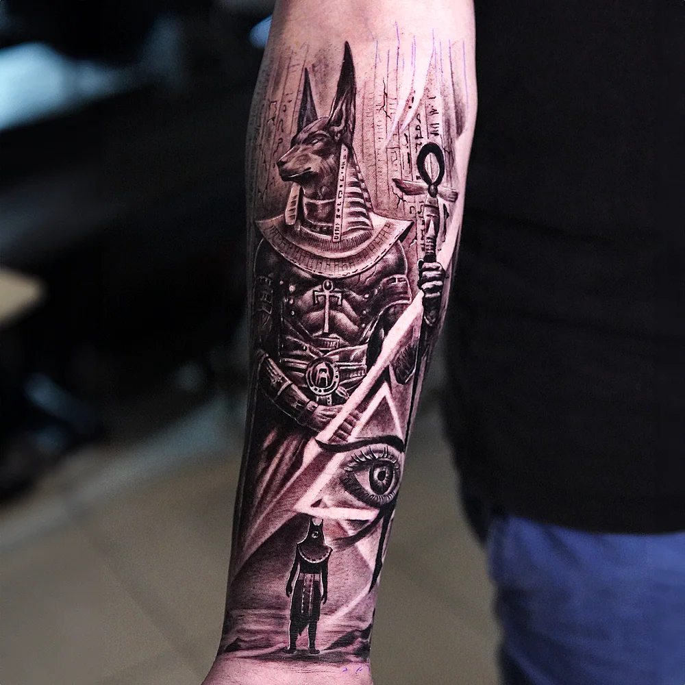 Anubis forearm tattoo, black and grey Egyptian design