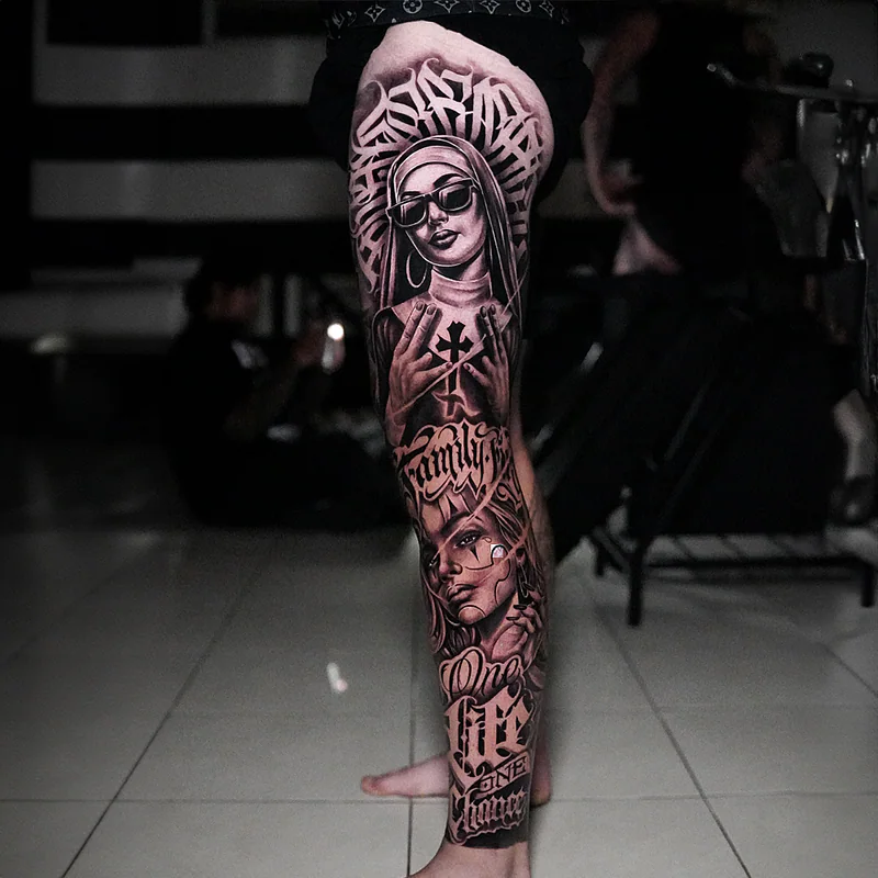 Black and grey leg sleeve tattoo with nun portrait and chicano lettering