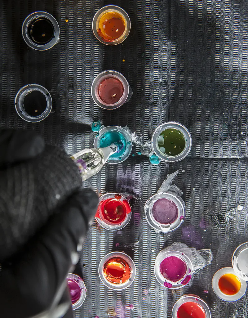 Tattoo ink caps lined up at the studio